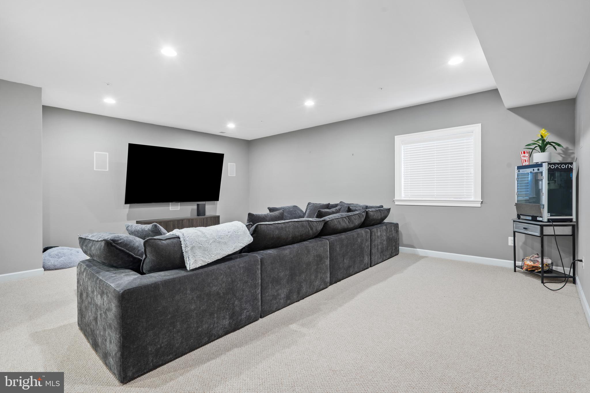 3822 Jacob Stout Road Doylestown, PA 18902 - Photo 8 of 39 a living room with furniture and a flat screen tv