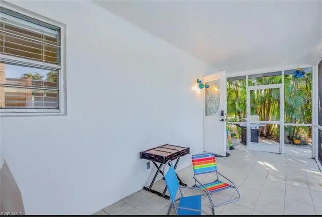 a room with furniture and a large window