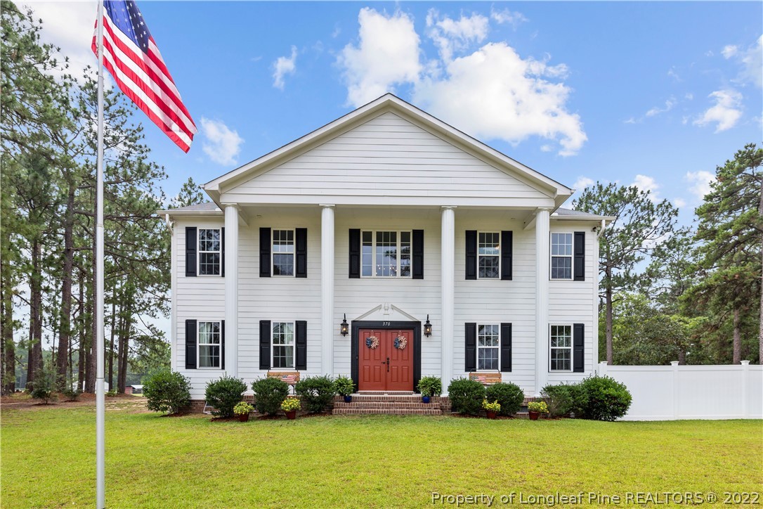 370 McIntosh Road Carthage, NC 28327 - Photo 1 of 43 a front view of a house with garden