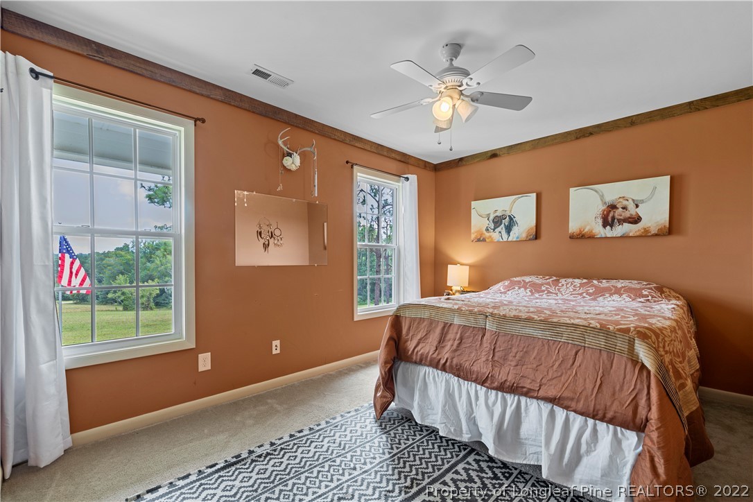 370 McIntosh Road Carthage, NC 28327 - Photo 27 of 43 a bedroom with a large bed and a window
