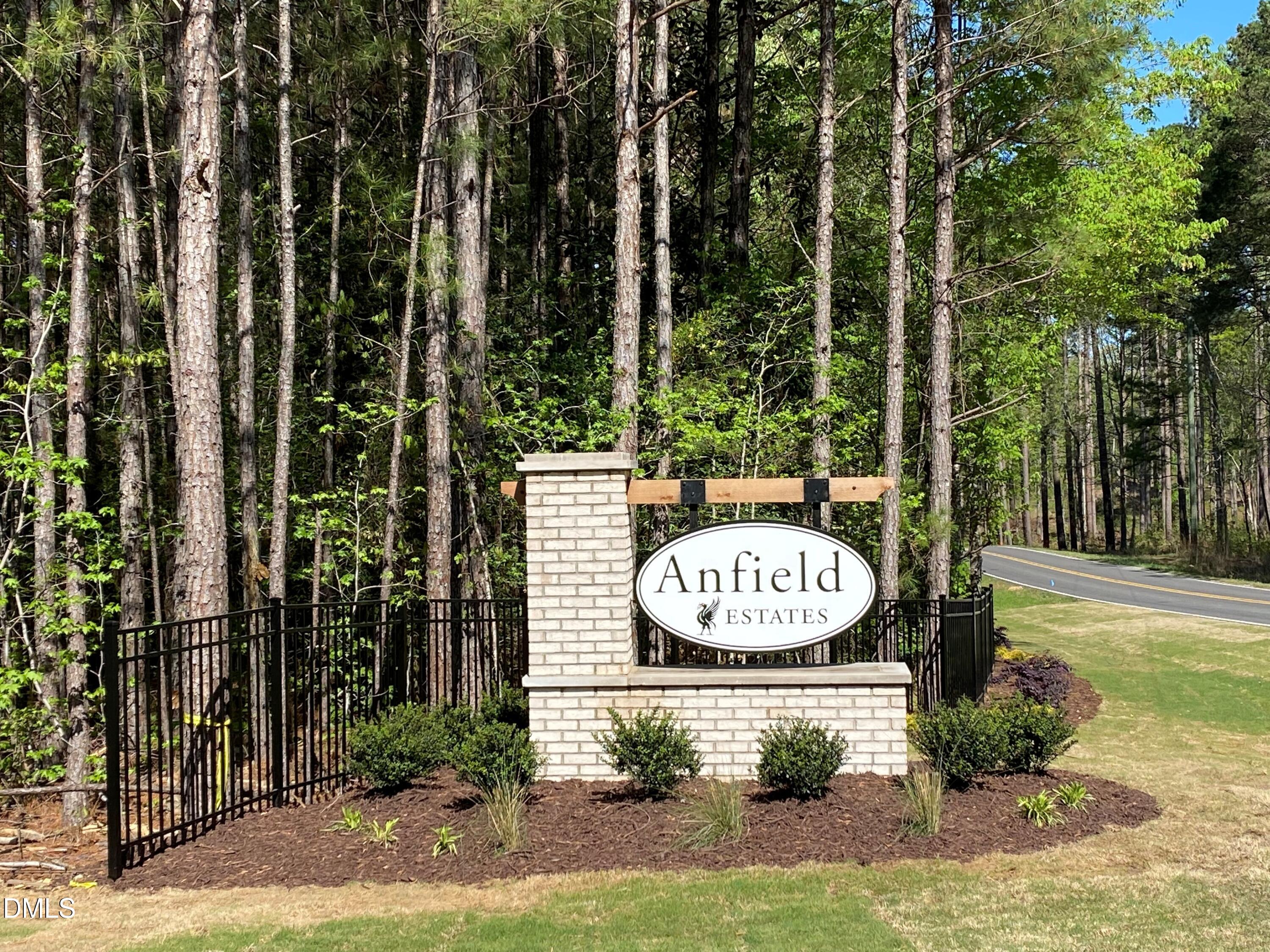 72 Anfield Road New Hill, NC 27562 - Photo 1 of 2 a view of outdoor space with garden and lots of trees