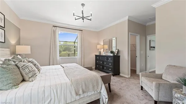 a bedroom with a bed and ceiling fan