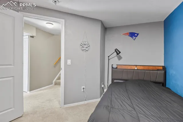 a bathroom with a toilet a sink and a mirror