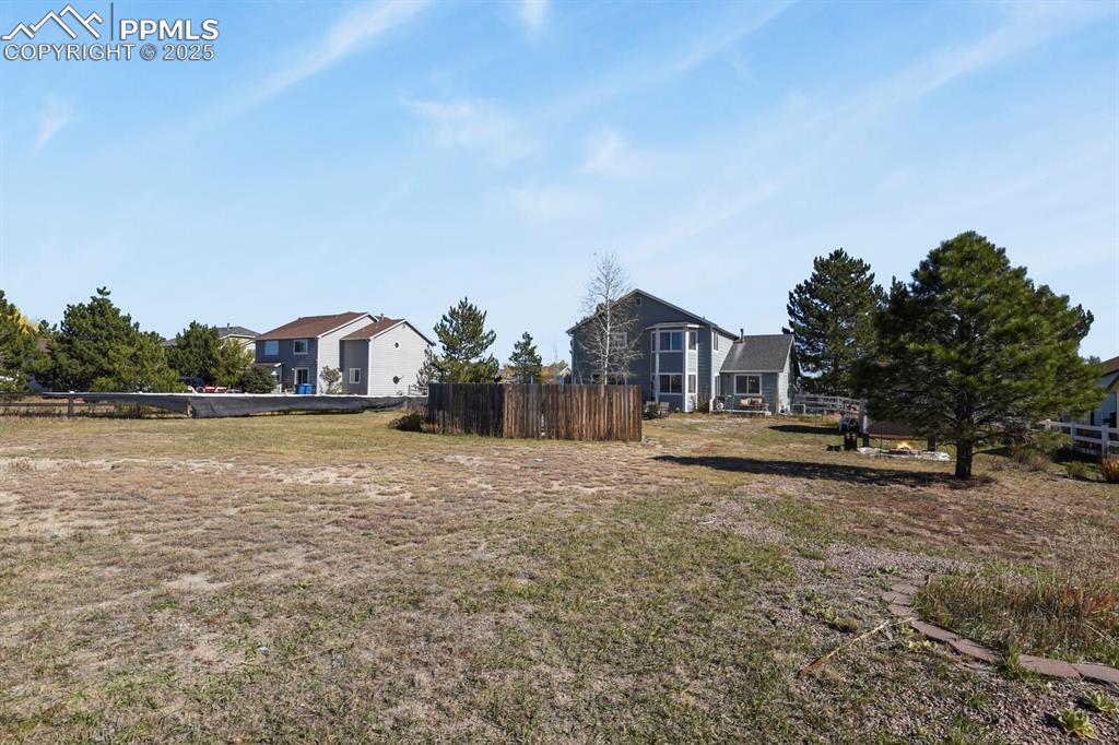 7660 Bullet Road Peyton, CO 80831 - Photo 41 of 50 a swimming pool with outdoor seating and yard