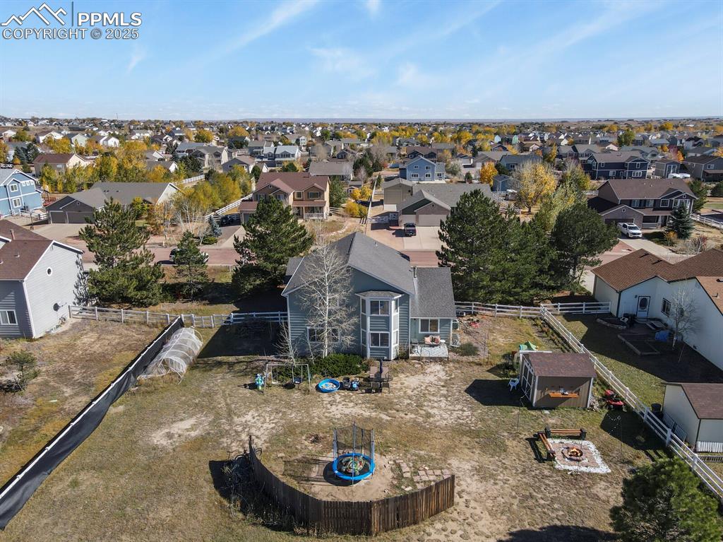 7660 Bullet Road Peyton, CO 80831 - Photo 46 of 50 an aerial view of a house with garden space and ocean view