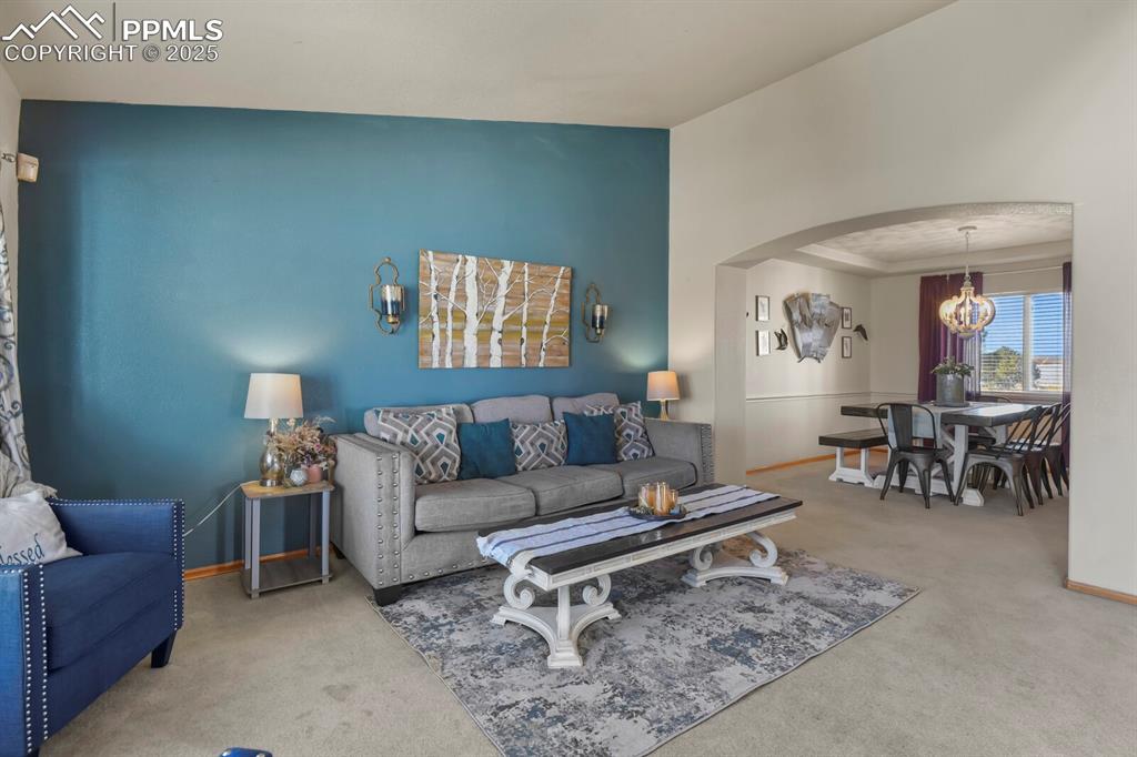 7660 Bullet Road Peyton, CO 80831 - Photo 5 of 50 a living room with furniture and a table