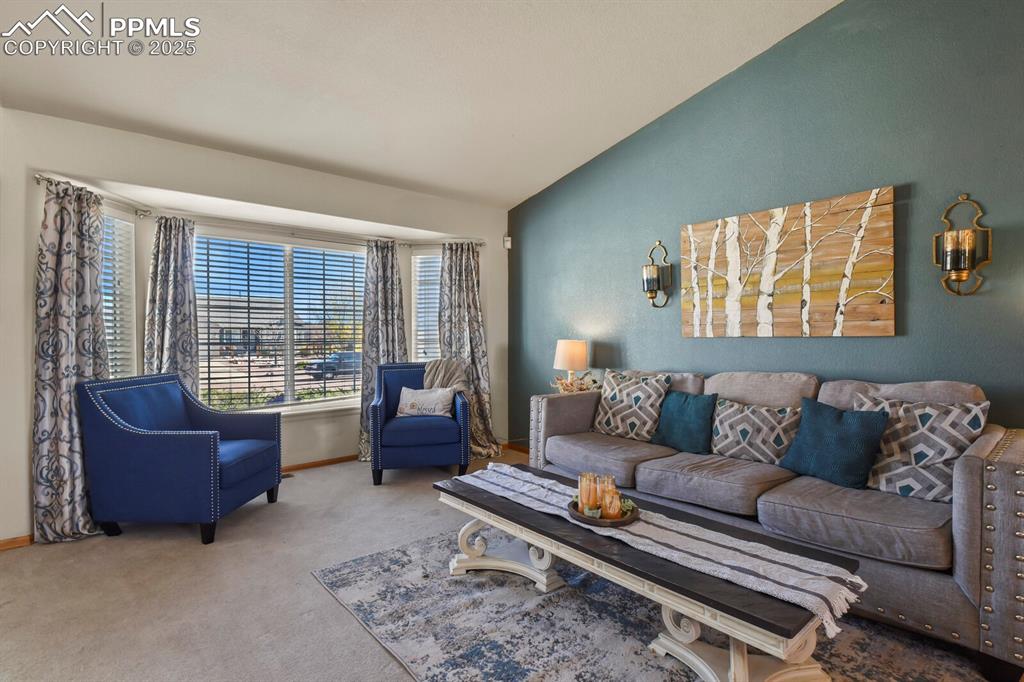 7660 Bullet Road Peyton, CO 80831 - Photo 6 of 50 a living room with furniture and a large window