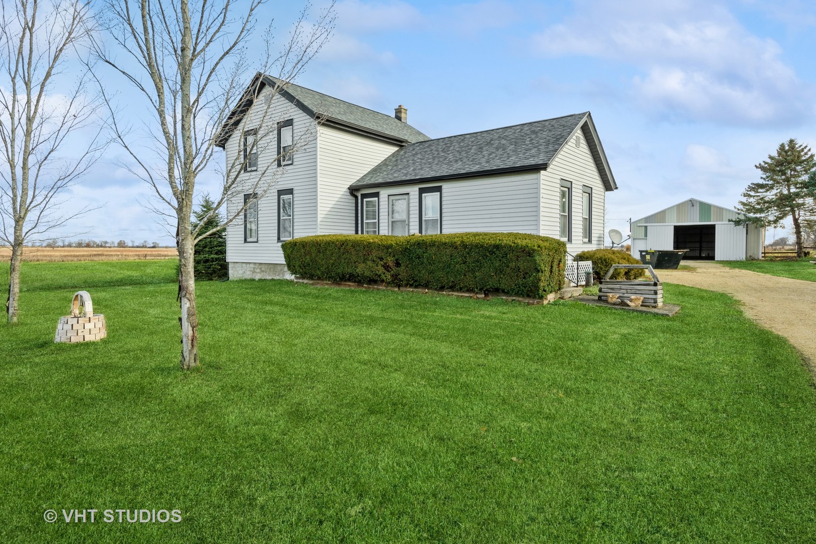 N1506 County C Road Sharon, WI 53585 - Photo 1 of 19 a front view of a house with garden