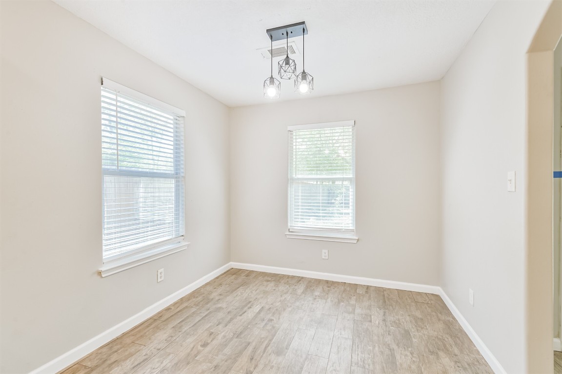 16468 Ryan Guinn Way Conroe, TX 77303 - Photo 12 of 31 an empty room with a window