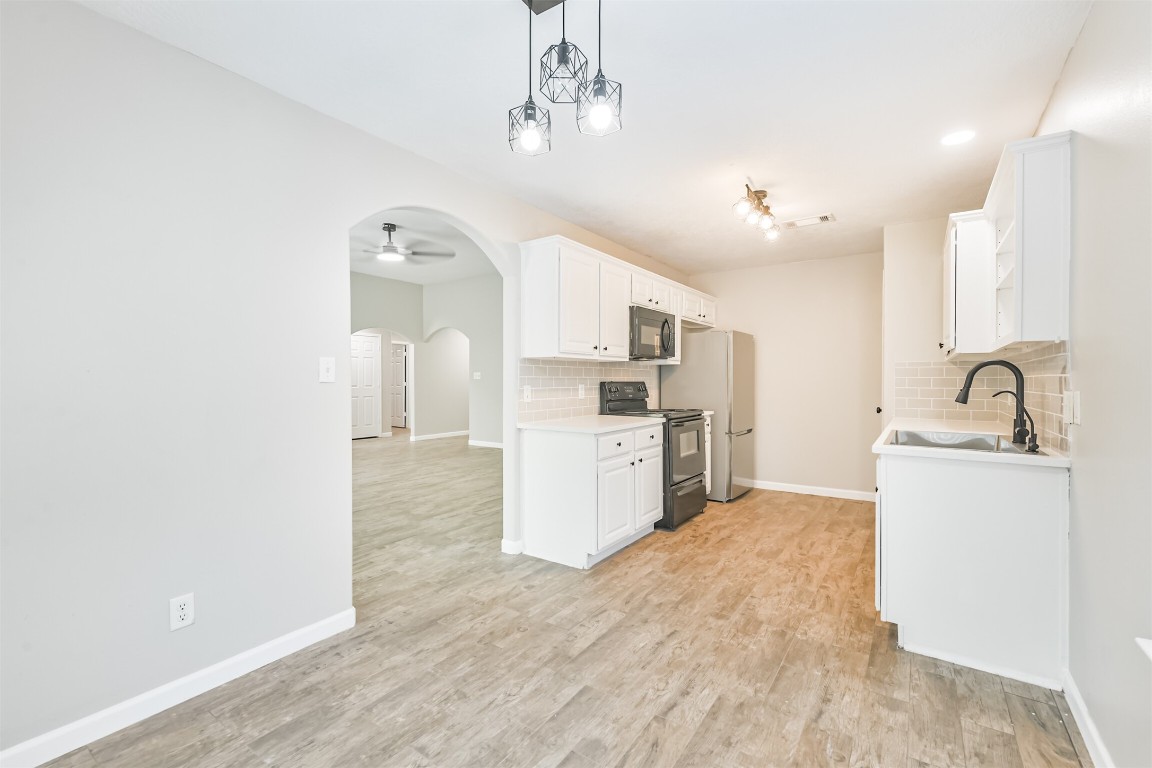 16468 Ryan Guinn Way Conroe, TX 77303 - Photo 14 of 31 a view of a kitchen with a sink