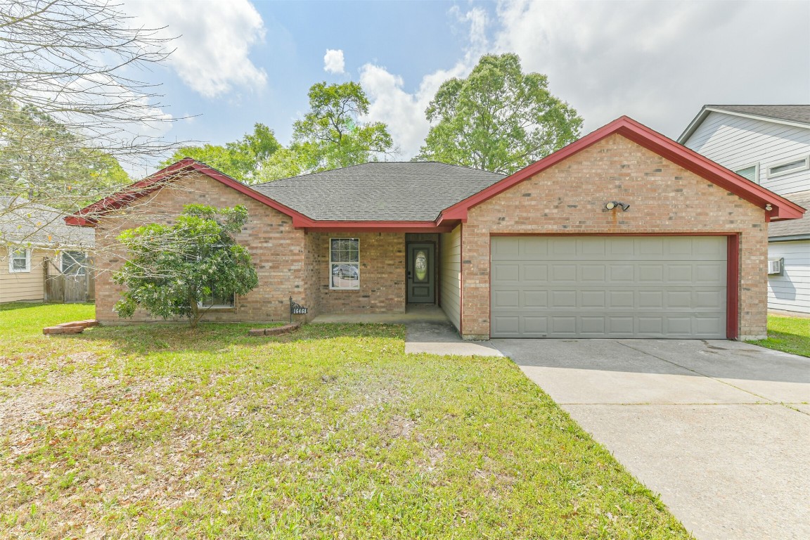 16468 Ryan Guinn Way Conroe, TX 77303 - Photo 2 of 31 a view of backyard of house with green space