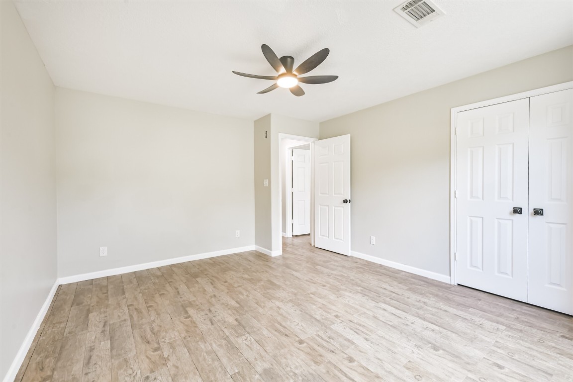 16468 Ryan Guinn Way Conroe, TX 77303 - Photo 25 of 31 a view of empty room with wooden floor