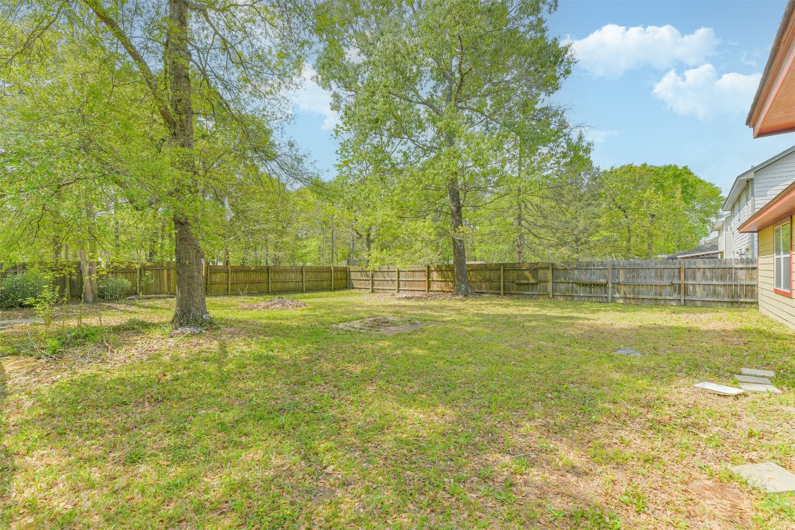 16468 Ryan Guinn Way Conroe, TX 77303 - Photo 30 of 31 a view of a swimming pool with an outdoor space and seating area