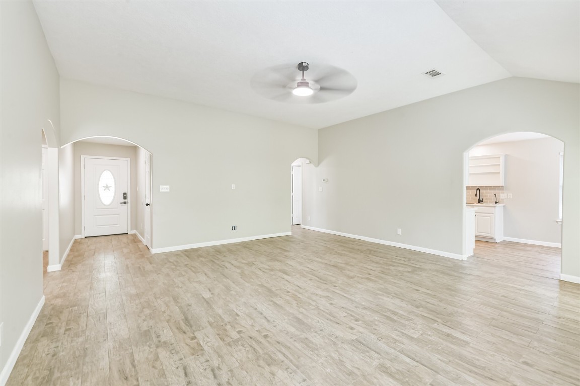 16468 Ryan Guinn Way Conroe, TX 77303 - Photo 7 of 31 wooden floor in an empty room