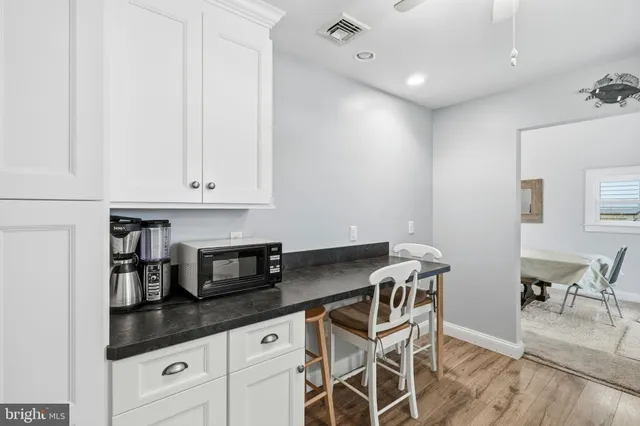 a bedroom with a bed and a table with lamp