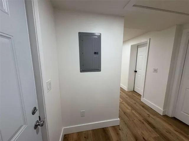 a view of room with wooden floor