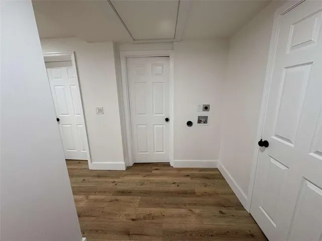 a view of room with wooden floor