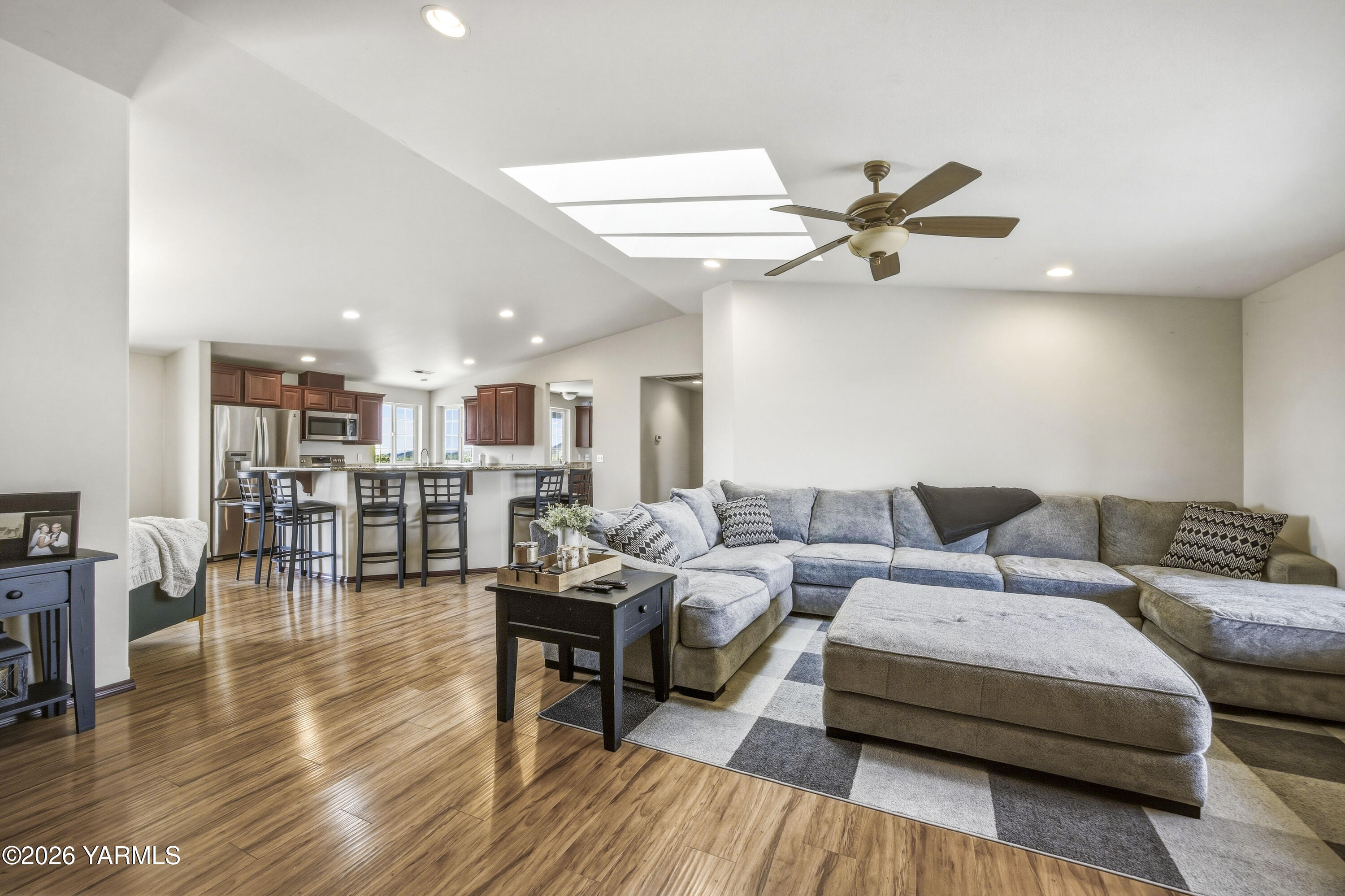 2050 Olmstead Road Grandview, WA 98930 - Photo 30 of 60 a living room with furniture and a view of kitchen