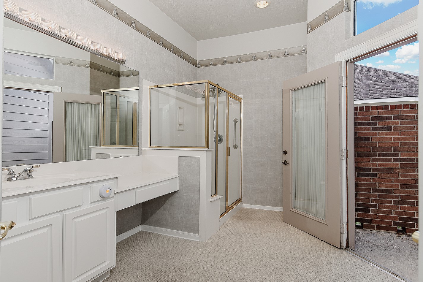 7 Sovereign Way Conroe, TX 77384 - Photo 19 of 47 a bathroom with a double vanity sink mirror and shower