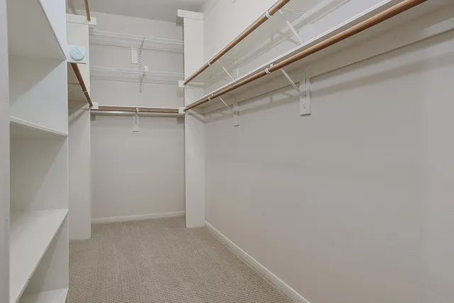 a view of an empty walk in closet