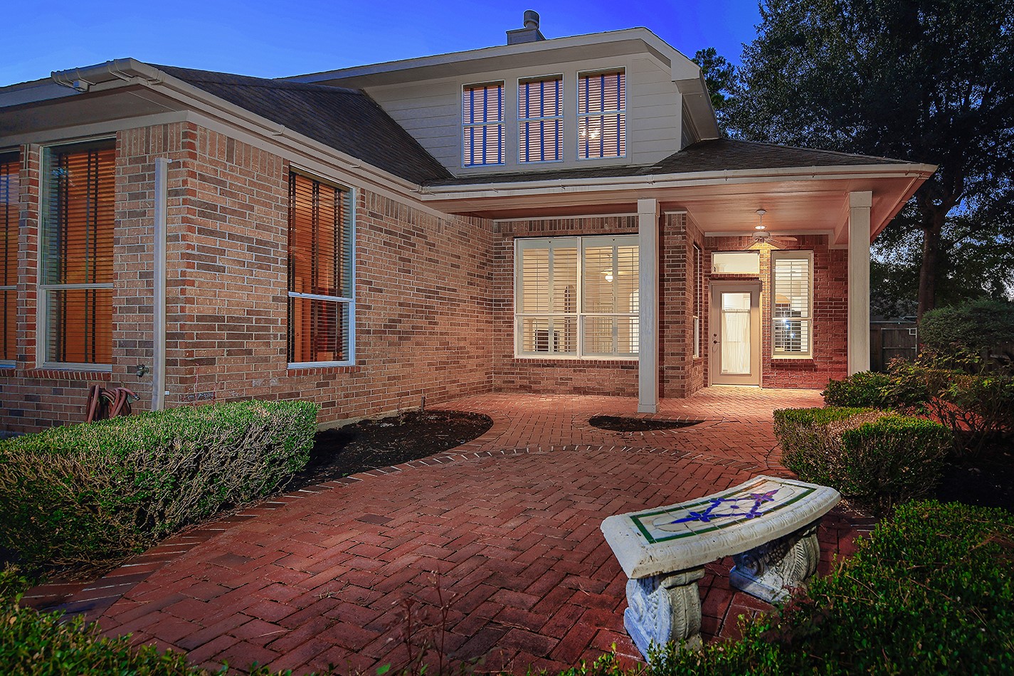 7 Sovereign Way Conroe, TX 77384 - Photo 29 of 47 a front view of a house with garden