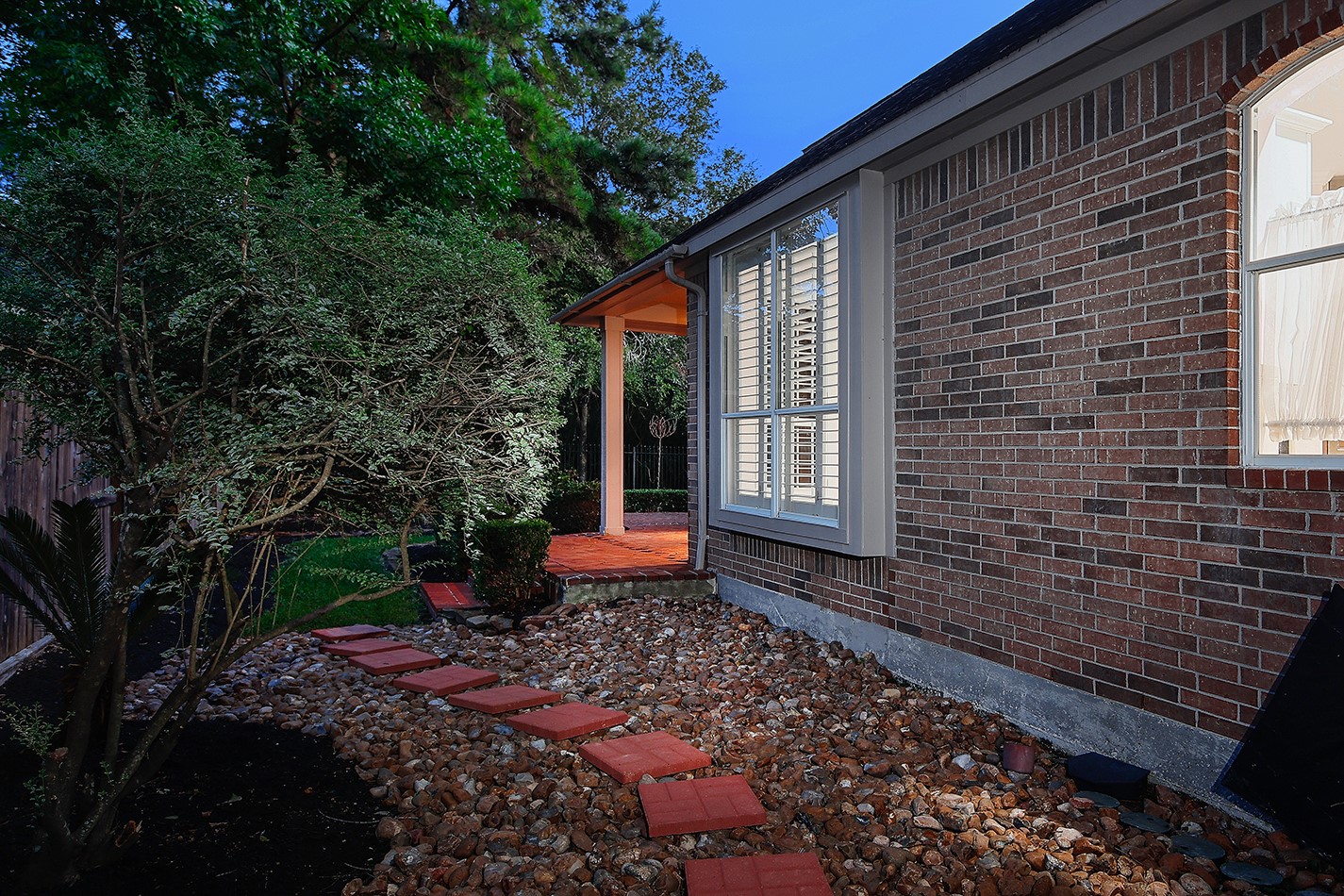 7 Sovereign Way Conroe, TX 77384 - Photo 31 of 47 a front view of a house with garden