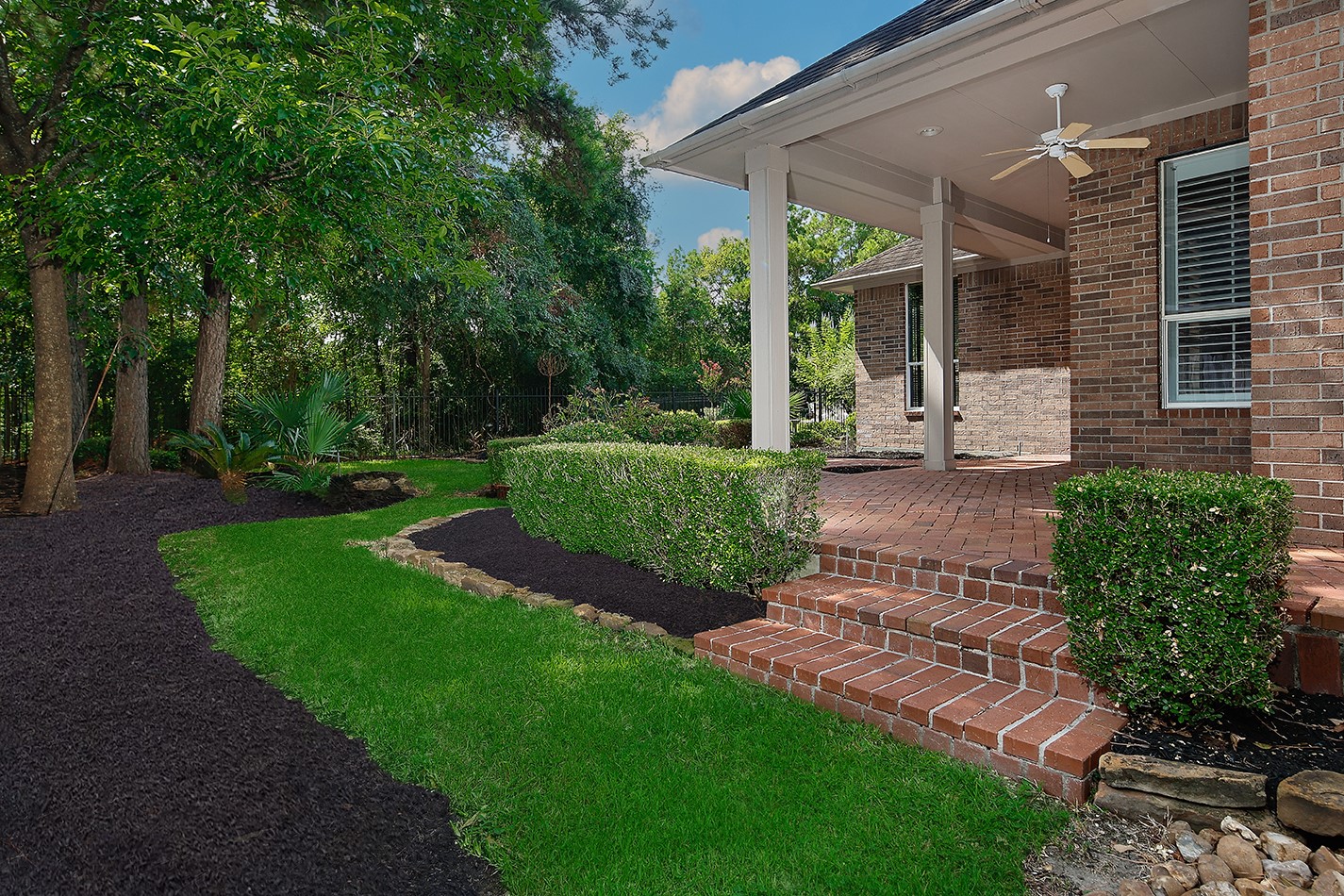 7 Sovereign Way Conroe, TX 77384 - Photo 32 of 47 a view of a patio with table and chairs potted plants and large tree
