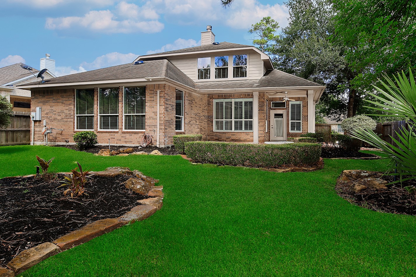 7 Sovereign Way Conroe, TX 77384 - Photo 34 of 47 a front view of a house with a yard
