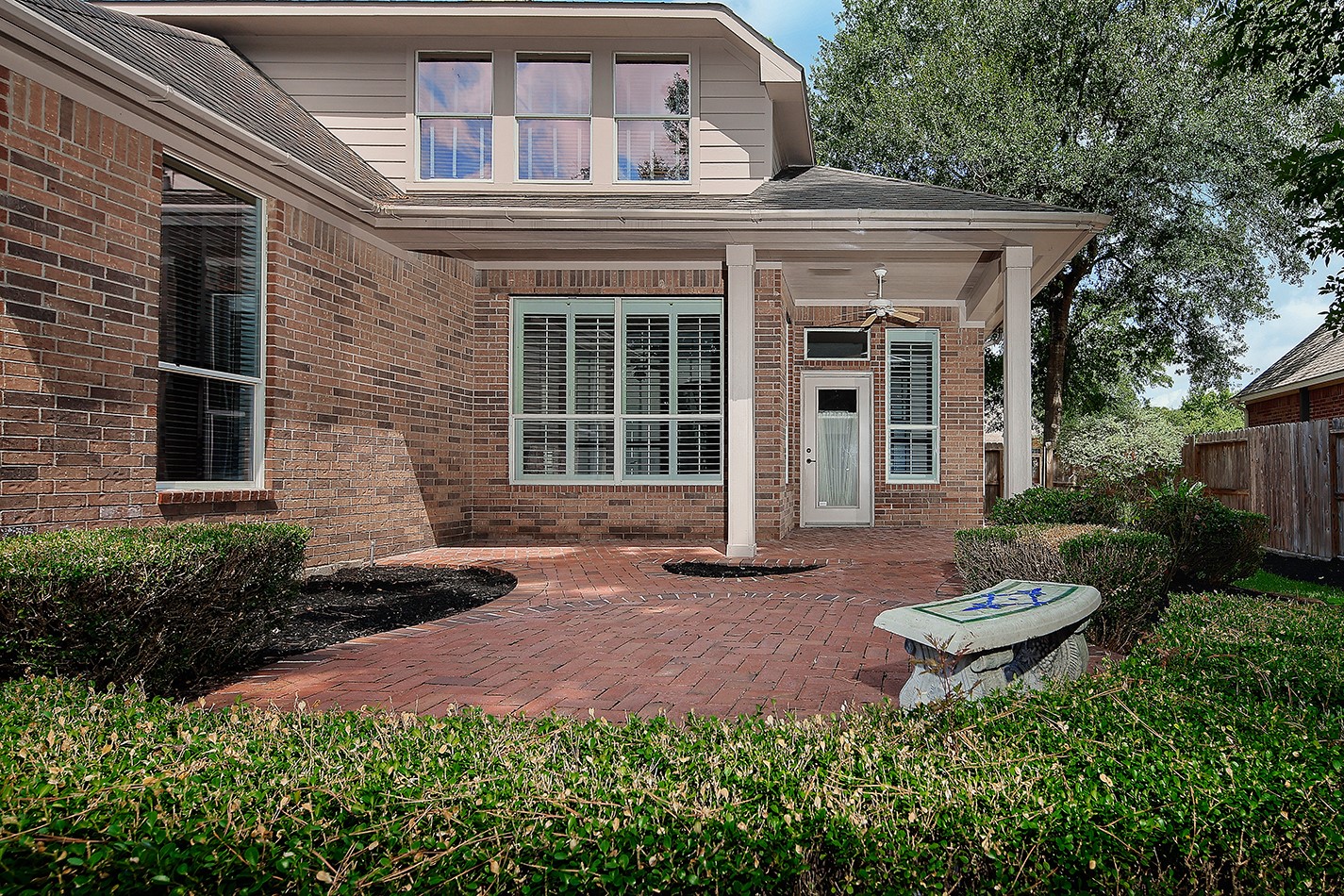 7 Sovereign Way Conroe, TX 77384 - Photo 35 of 47 a front view of a house with a yard and outdoor seating