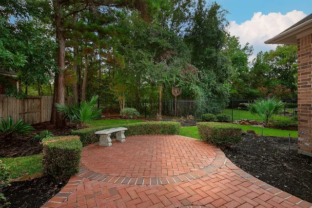 a view of backyard with seating area and green space