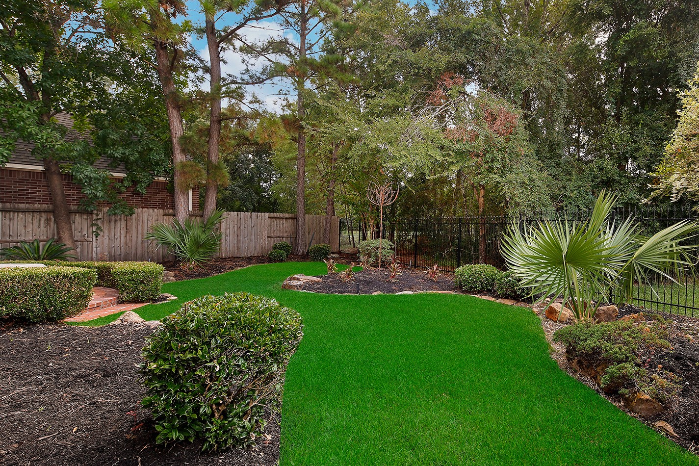 7 Sovereign Way Conroe, TX 77384 - Photo 37 of 47 a view of a garden with a tree