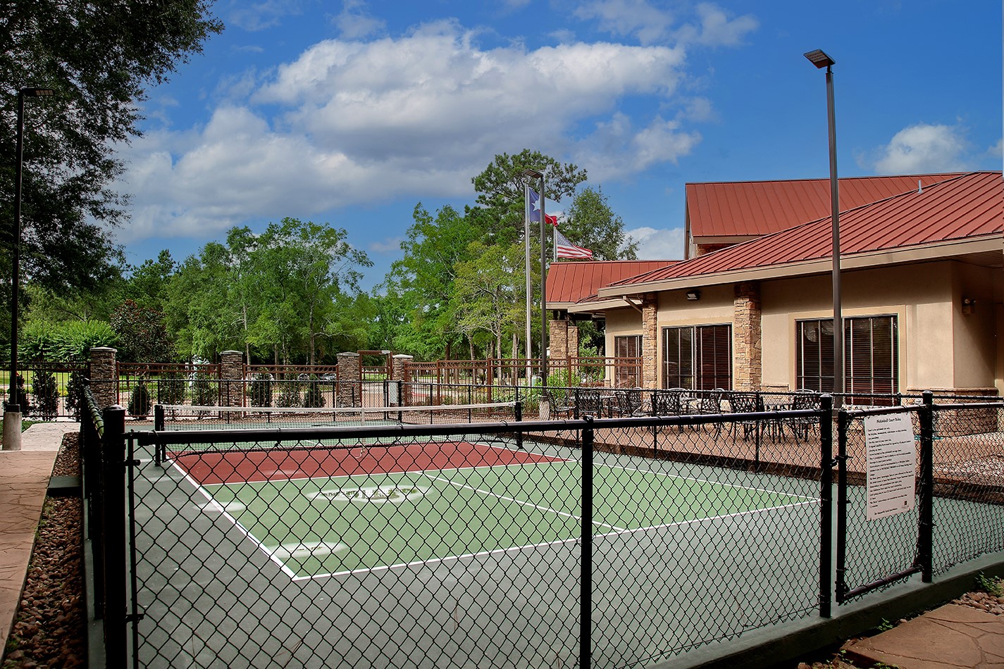 7 Sovereign Way Conroe, TX 77384 - Photo 47 of 47 a front view of a house with yard and sitting area