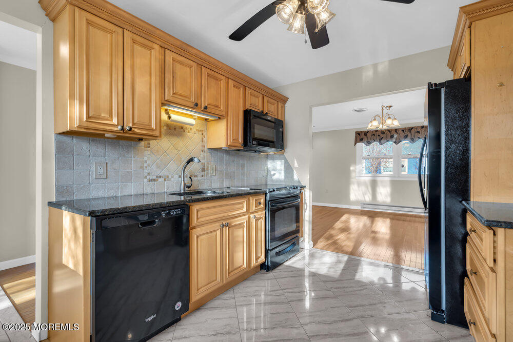 9 Apple Lane Whiting, NJ 08759 - Photo 11 of 17 a kitchen with stainless steel appliances granite countertop a stove sink and cabinets