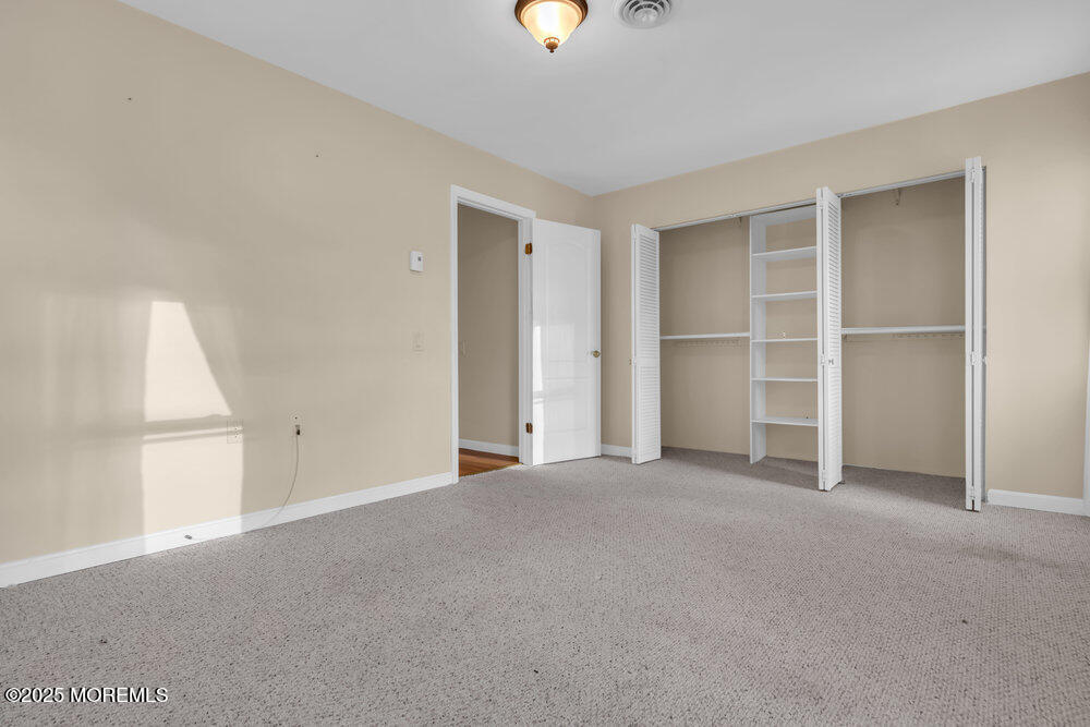 9 Apple Lane Whiting, NJ 08759 - Photo 14 of 17 a view of an empty room with a window