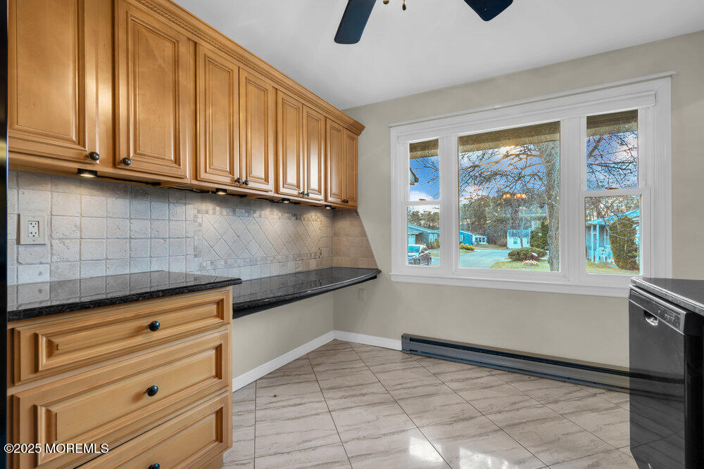 9 Apple Lane Whiting, NJ 08759 - Photo 10 of 17 a kitchen with granite countertop a stove a sink and a microwave