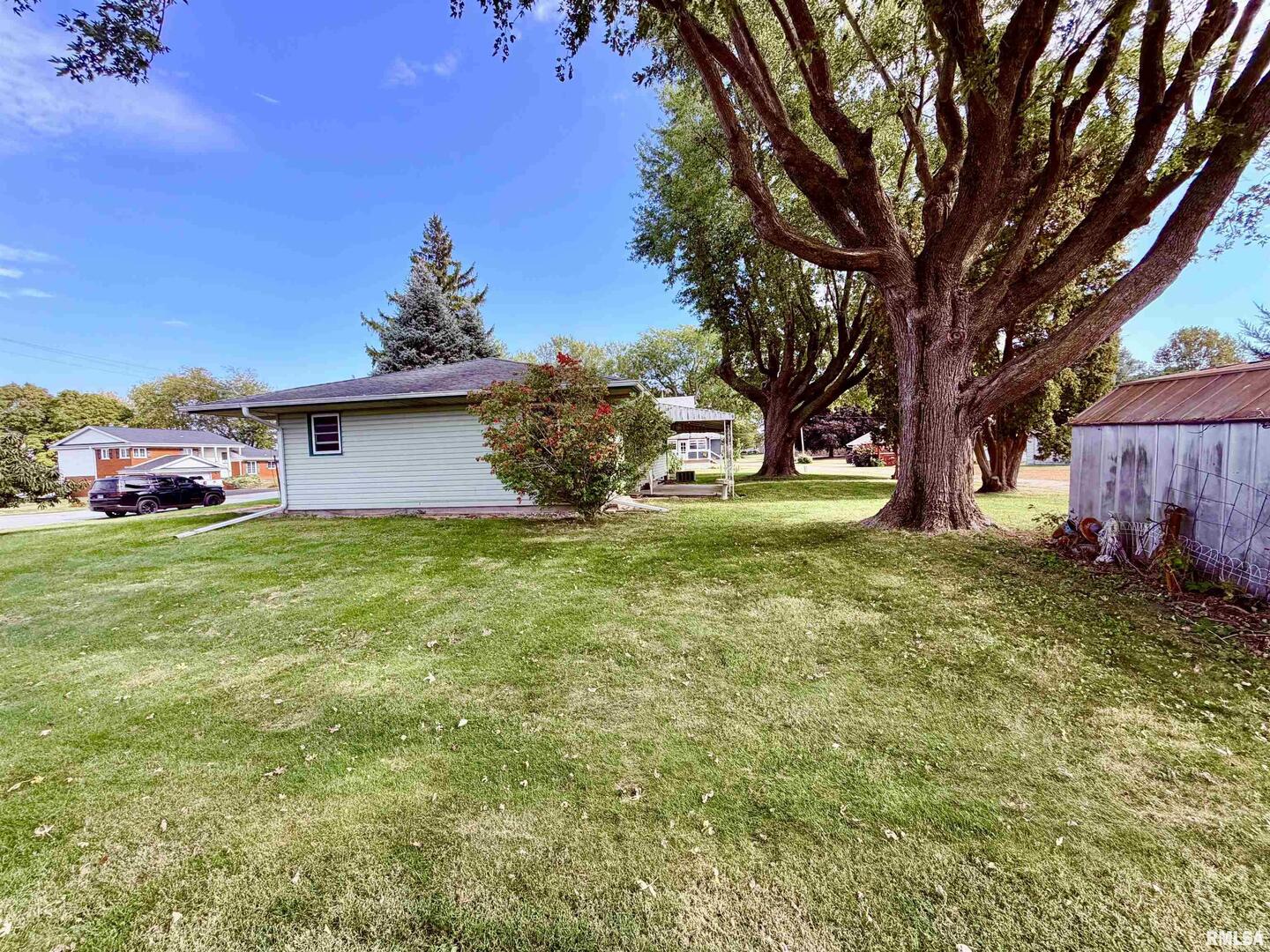 712 3rd Street Seaton, IL 61476 - Photo 14 of 15 a view of a house with a yard
