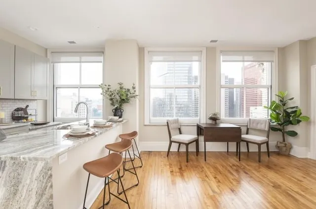 a view of a dining room with furniture and wooden floor