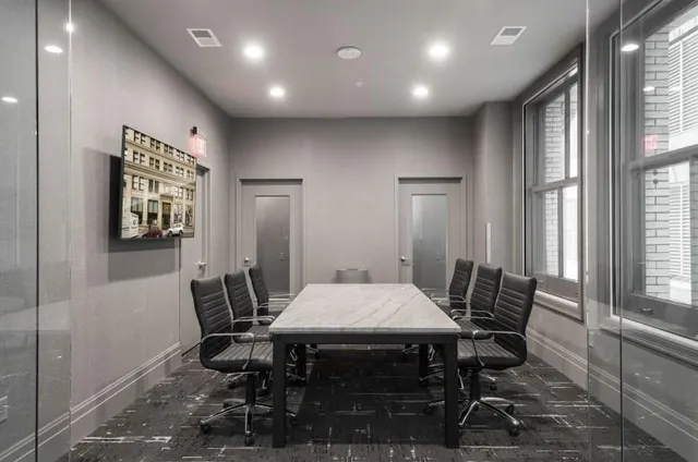 a view of a dining room with furniture and window