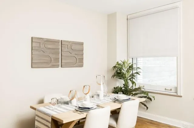 a dining room with furniture and wooden floor