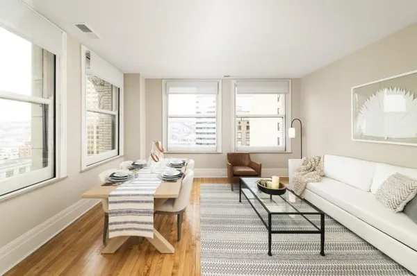 a living room with furniture and a large window