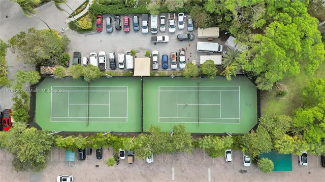 an aerial view of a house with yard swimming pool and outdoor seating