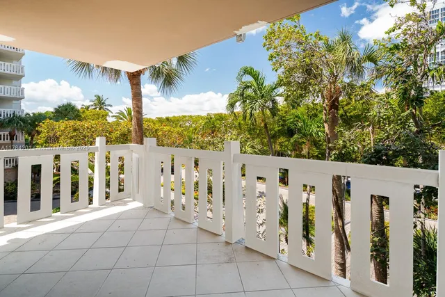 a view of entrance gate with wooden fence