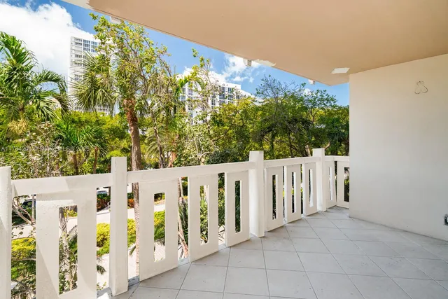 a view of a building with wooden fence
