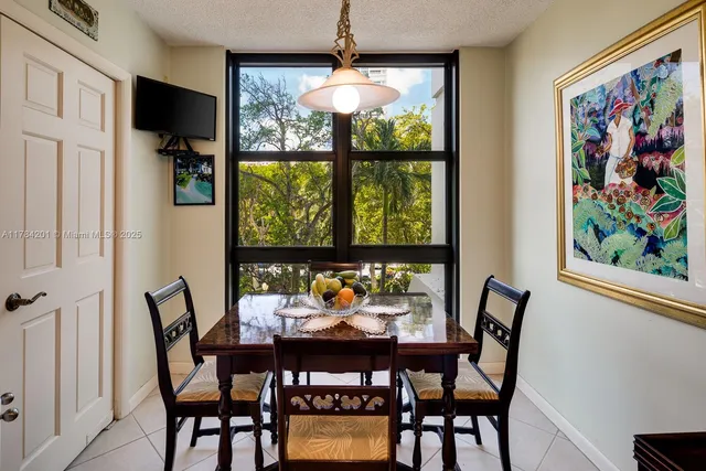 a view of a dining room with furniture window and outside view