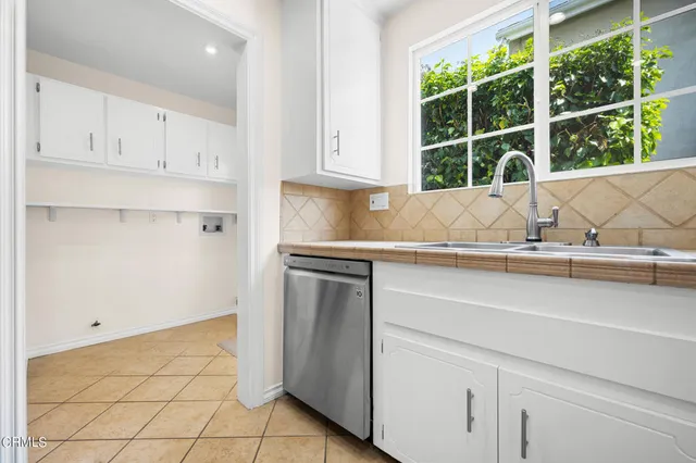 a kitchen with a sink and cabinets
