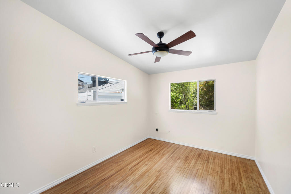 17149 Bullock Street Encino, CA 91316 - Photo 20 of 32 a view of a big room with wooden floor and windows