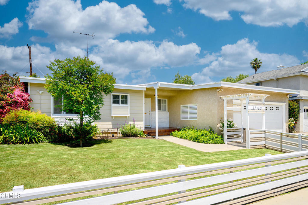 17149 Bullock Street Encino, CA 91316 - Photo 2 of 32 a front view of a house with garden