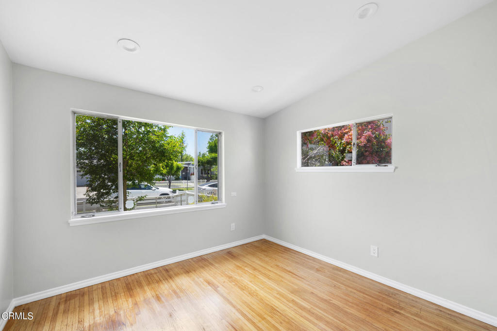 17149 Bullock Street Encino, CA 91316 - Photo 24 of 32 a view of empty room with wooden floor and fan