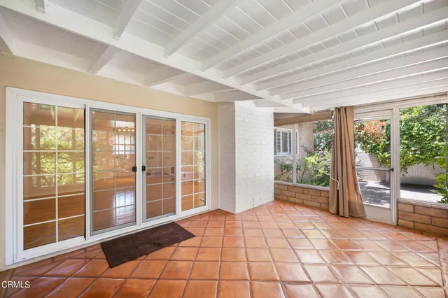 a view of empty room with windows