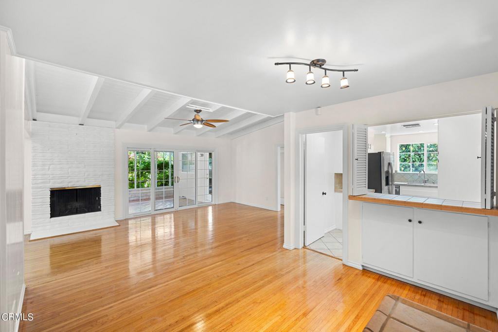 17149 Bullock Street Encino, CA 91316 - Photo 4 of 32 a view of an empty room with wooden floor and a window